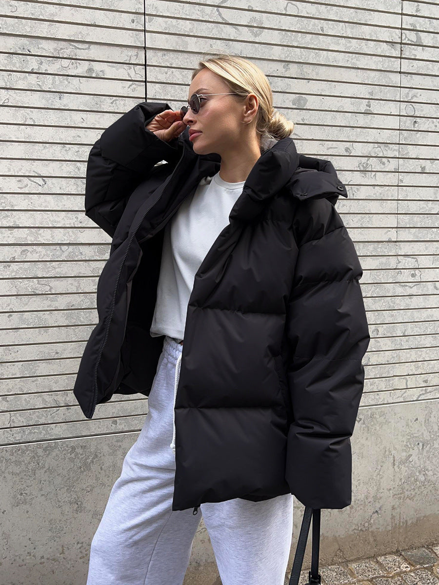 Cozy Black Hooded Puffer Jacket for Women with Zip Front Side Pockets Oversized Insulated Winter Style