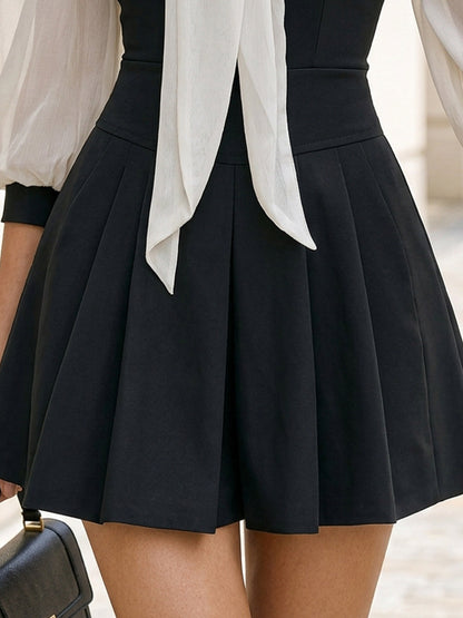 Elegant Black Cocktail Dress for Women with Tie Neck Bishop Sleeve Fit and Flare Pleated Party Style
