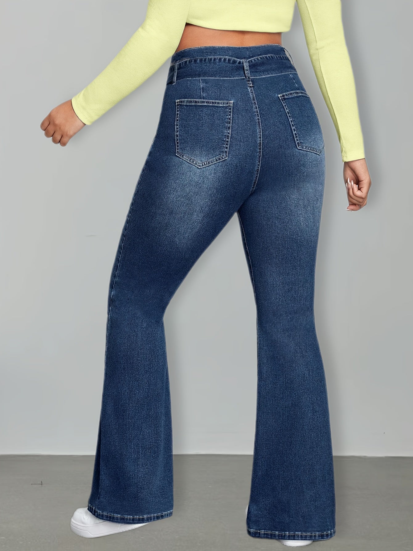 Effortless Medium Blue Buckle Jeans for Women with High Waist Flare Leg Relaxed Casual Style