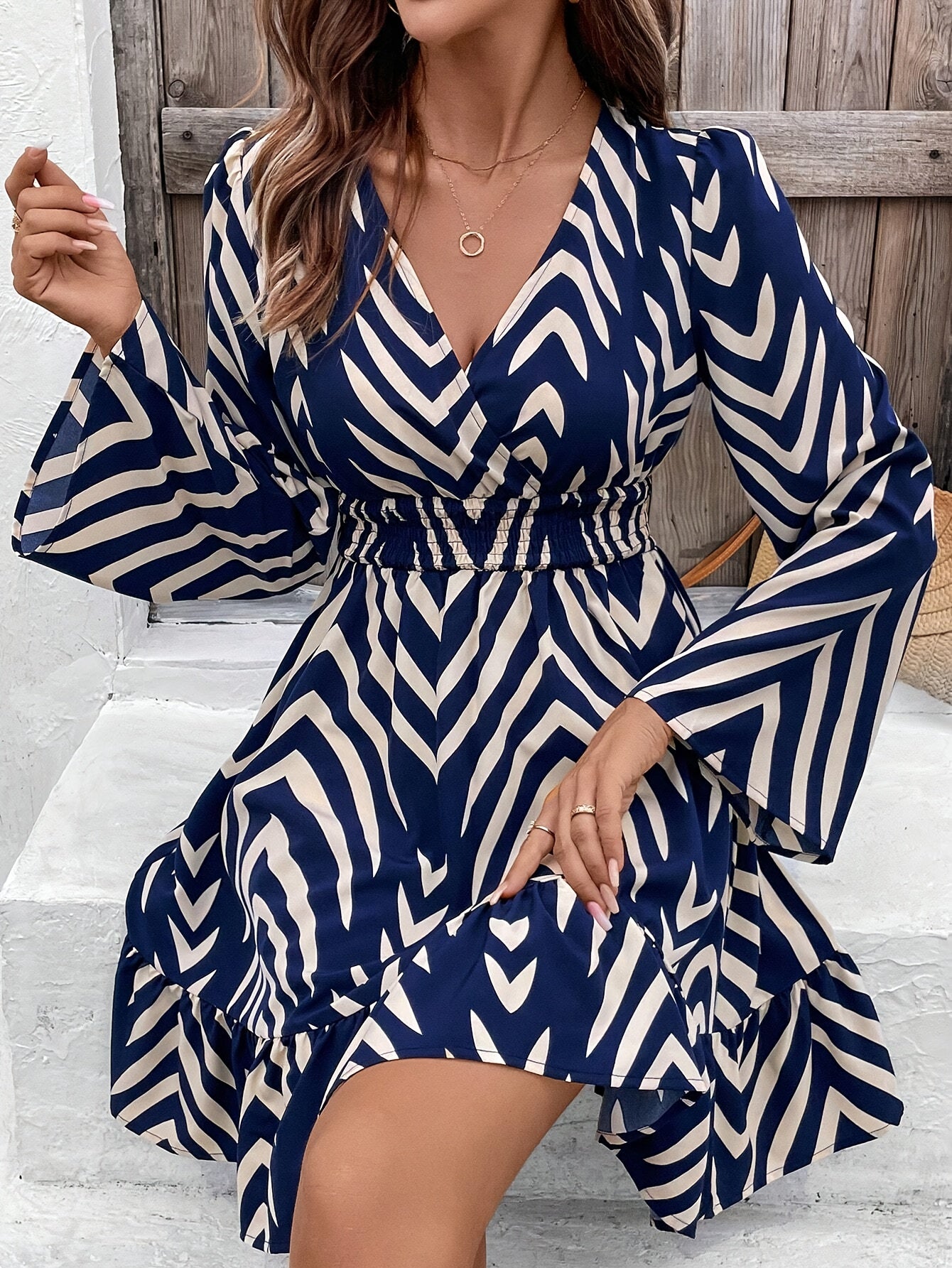 Elegant Blue Chevron Print Wrap Dress for Women with V Neck Bell Sleeve Ruffle Hem Flowing Style