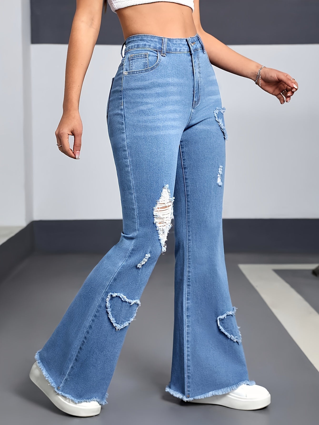 Effortless Light Blue Distressed Flare Jeans for Women with High Waist Heart Patch Frayed Hem Casual Style