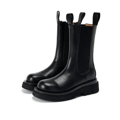 Sleek Black Leather Chelsea Boots for Women with Round Toe Pull Tab Lug Sole Platform Style