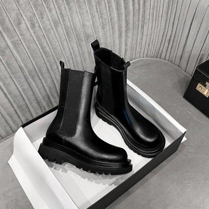 Sleek Black Leather Chelsea Boots for Women with Round Toe Pull Tab Lug Sole Platform Style