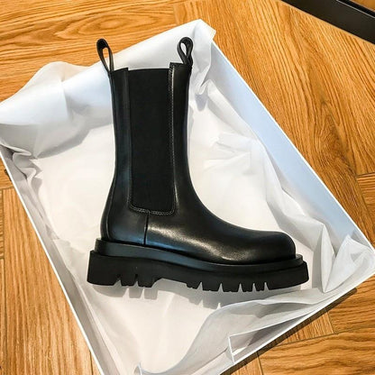 Sleek Black Leather Chelsea Boots for Women with Round Toe Pull Tab Lug Sole Platform Style