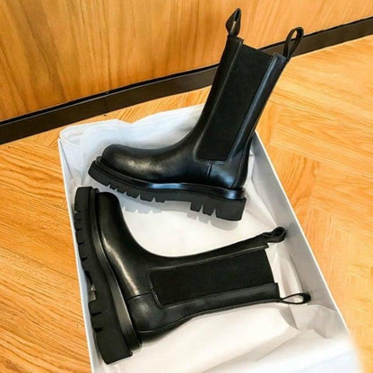 Sleek Black Leather Chelsea Boots for Women with Round Toe Pull Tab Lug Sole Platform Style
