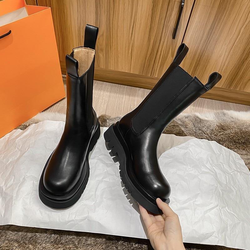 Sleek Black Leather Chelsea Boots for Women with Round Toe Pull Tab Lug Sole Platform Style