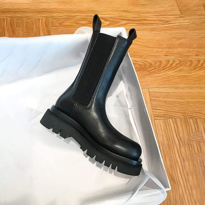 Sleek Black Leather Chelsea Boots for Women with Round Toe Pull Tab Lug Sole Platform Style