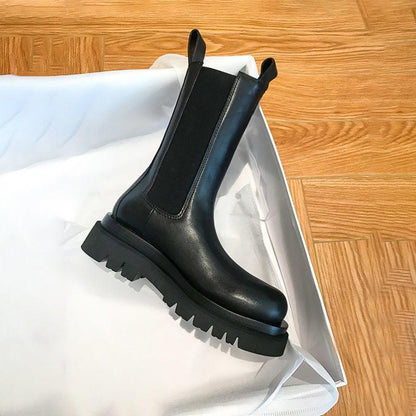 Sleek Black Leather Chelsea Boots for Women with Round Toe Pull Tab Lug Sole Platform Style