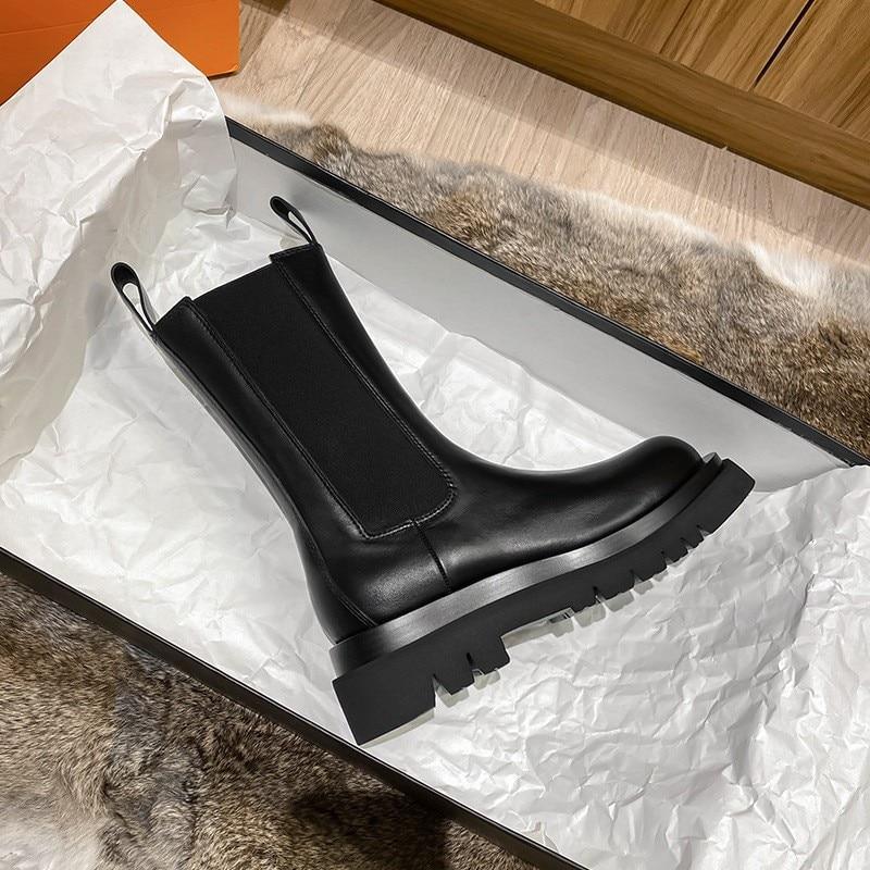 Sleek Black Leather Chelsea Boots for Women with Round Toe Pull Tab Lug Sole Platform Style