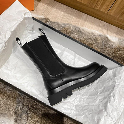 Sleek Black Leather Chelsea Boots for Women with Round Toe Pull Tab Lug Sole Platform Style