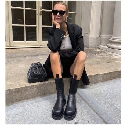 Sleek Black Leather Chelsea Boots for Women with Round Toe Pull Tab Lug Sole Platform Style