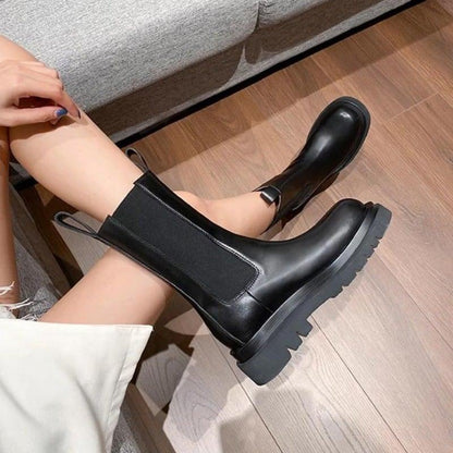 Sleek Black Leather Chelsea Boots for Women with Round Toe Pull Tab Lug Sole Platform Style