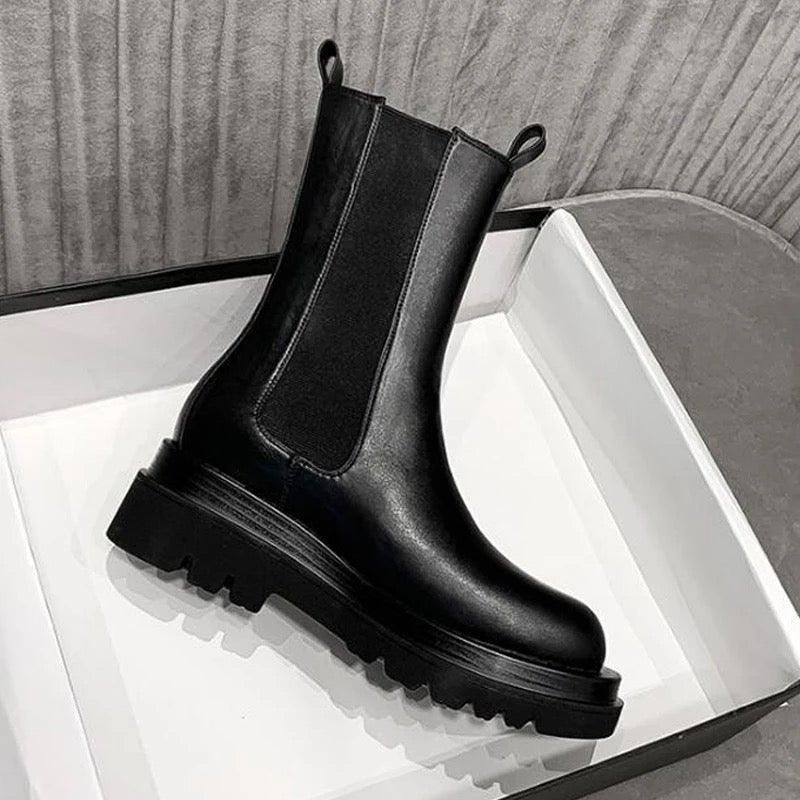 Sleek Black Leather Chelsea Boots for Women with Round Toe Pull Tab Lug Sole Platform Style