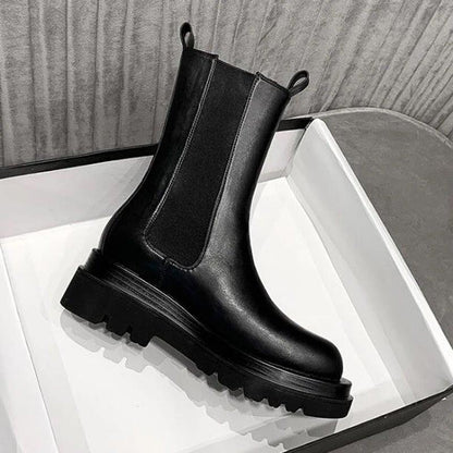 Sleek Black Leather Chelsea Boots for Women with Round Toe Pull Tab Lug Sole Platform Style