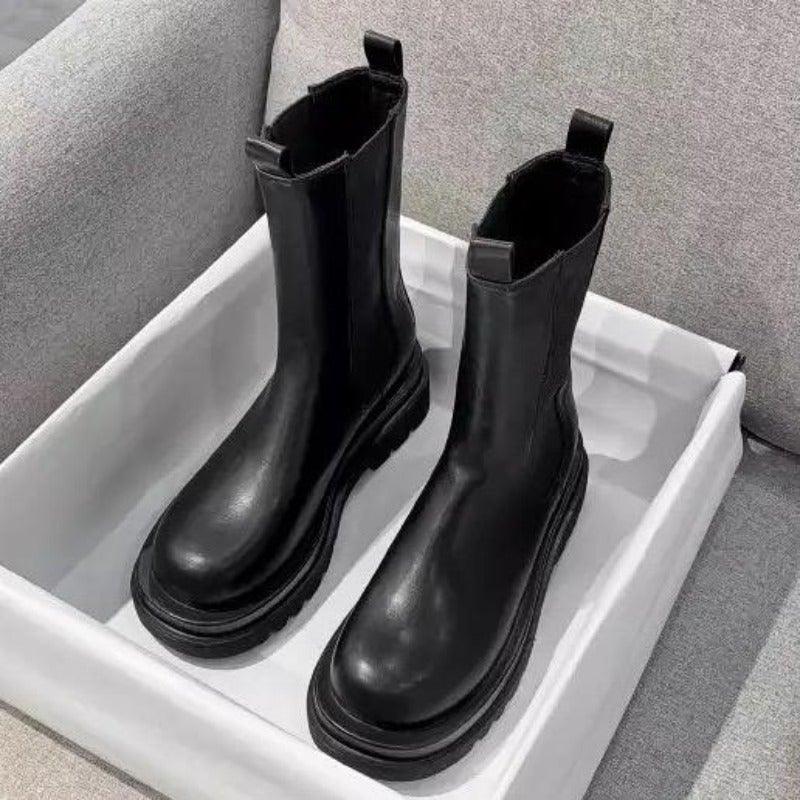 Sleek Black Leather Chelsea Boots for Women with Round Toe Pull Tab Lug Sole Platform Style