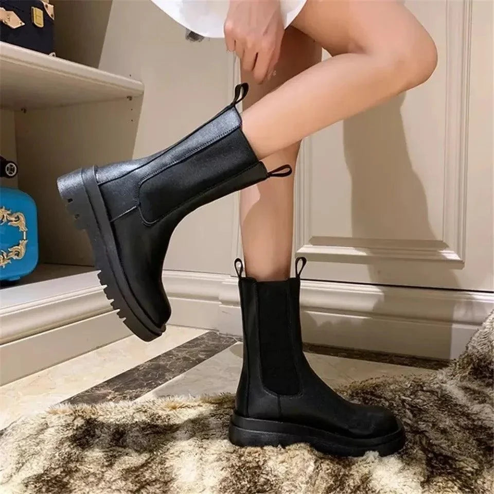 Sleek Black Leather Chelsea Boots for Women with Round Toe Pull Tab Lug Sole Platform Style