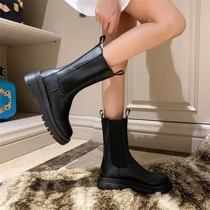 Sleek Black Leather Chelsea Boots for Women with Round Toe Pull Tab Lug Sole Platform Style