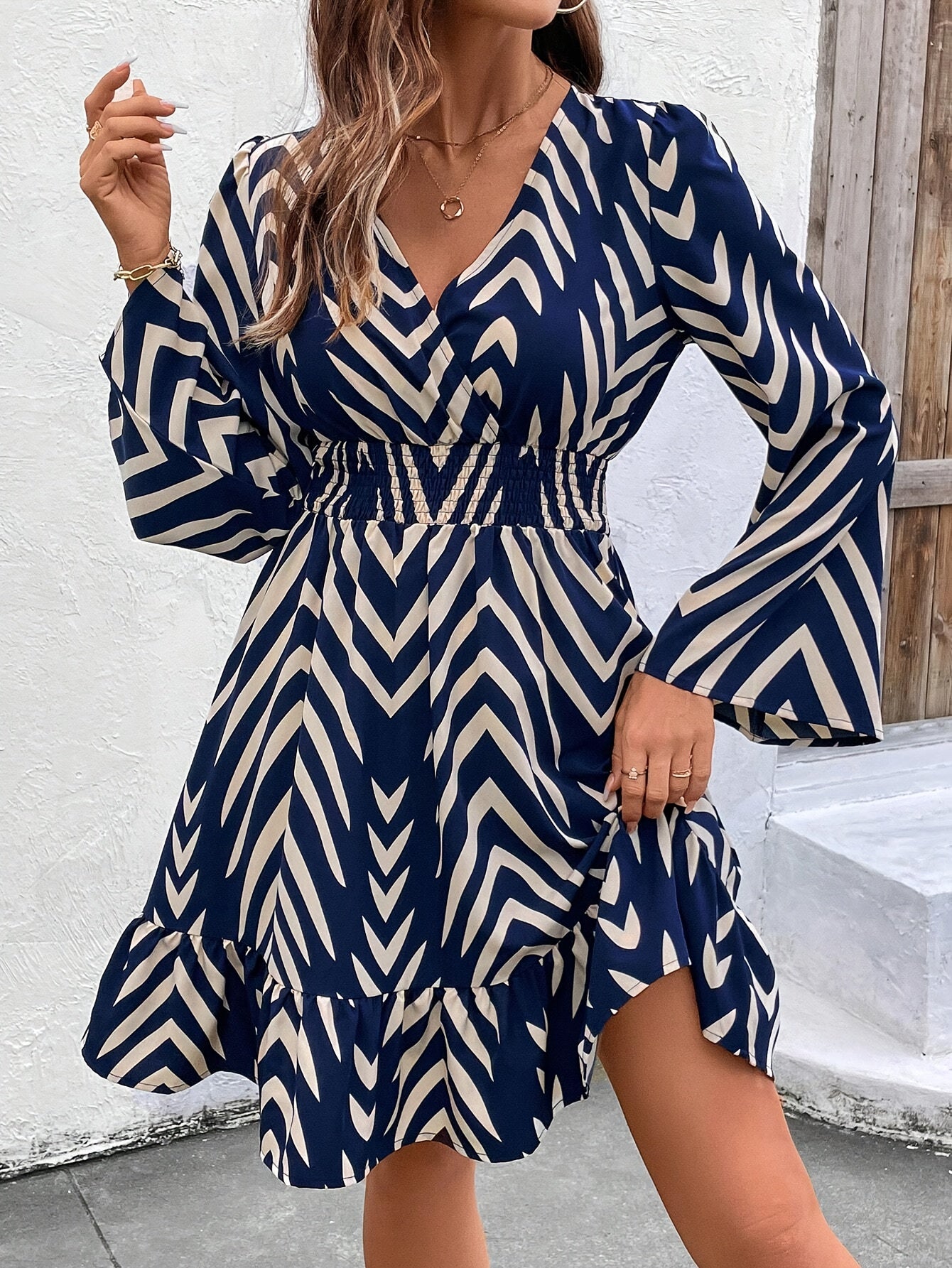 Elegant Blue Chevron Print Wrap Dress for Women with V Neck Bell Sleeve Ruffle Hem Flowing Style