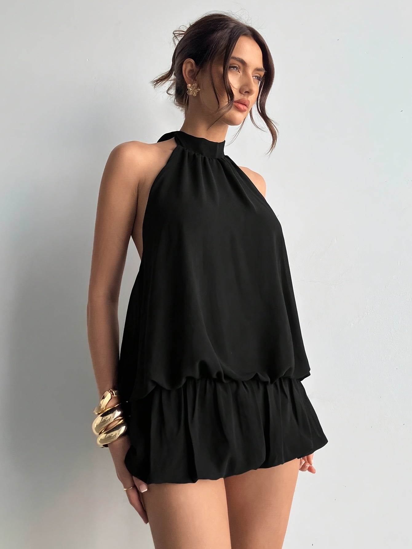 Elegant Little Black Dress for Women with Halter Neck Sleeveless Ruffle Hem Loose Fit Casual Party Style